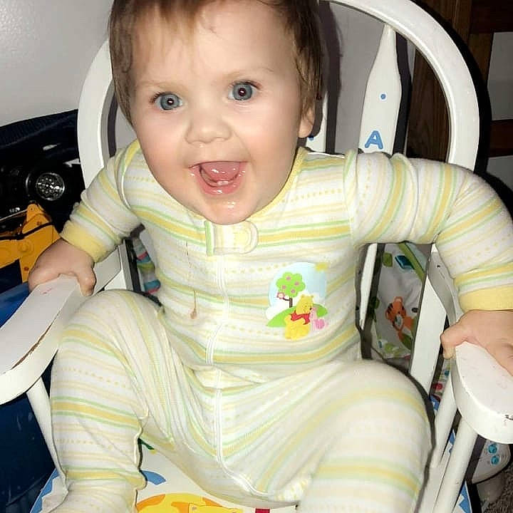 Brett is registered to the contest to win money with this photo: baby, car_seat, cheek, child, eating, nose, person, play, sitting, skin, smile, toddler