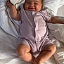 baby, infant, smiling, onesie, bed, blanket, white, comfortable, happy, cute, chubby_cheeks, sleepwear, person, young_child, skin, lying_down, indoors, portrait, soft_lighting, relaxed