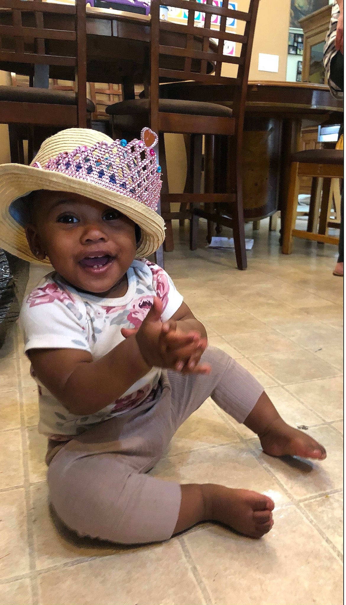 Averi joined the competition — help win amazing prizes! cap, chair, child, facial_expression, fashion_accessory, flooring, fun, happy, hat, headgear, headwear, human_leg, knee, leisure, person, skin, smile, sun_hat, thigh, toddler