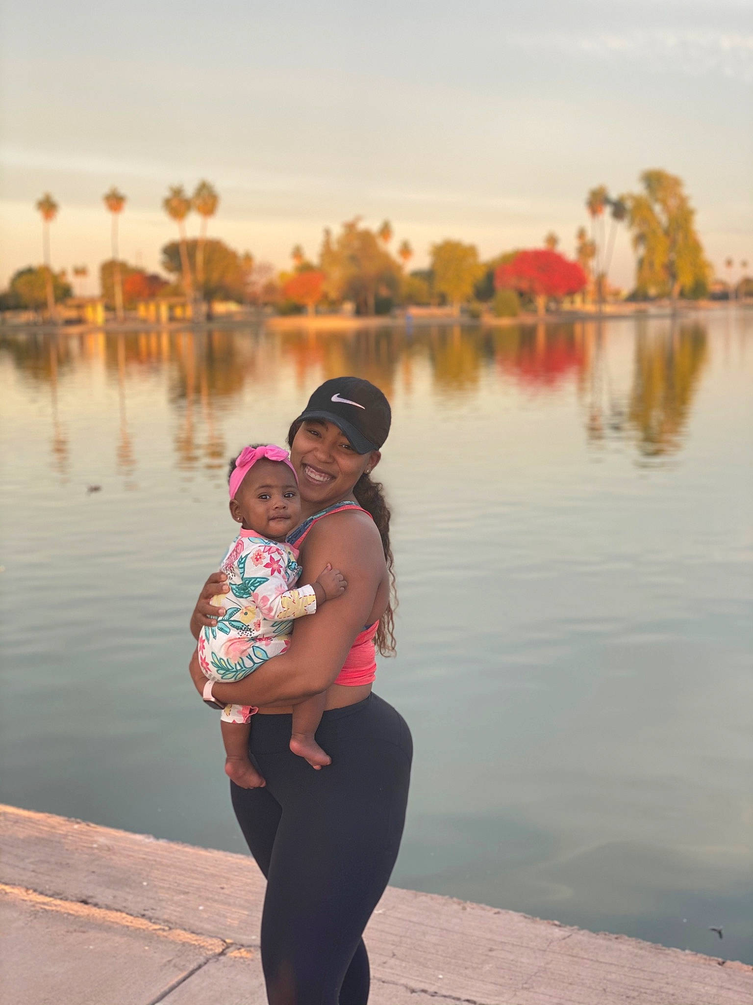 Averi joined the competition — help win amazing prizes! bank, dusk, eyewear, fun, happy, hat, headwear, horizon, joy, lake, landscape, leisure, people_in_nature, person, sky, smile, summer, sun_hat, sunglasses, sunset