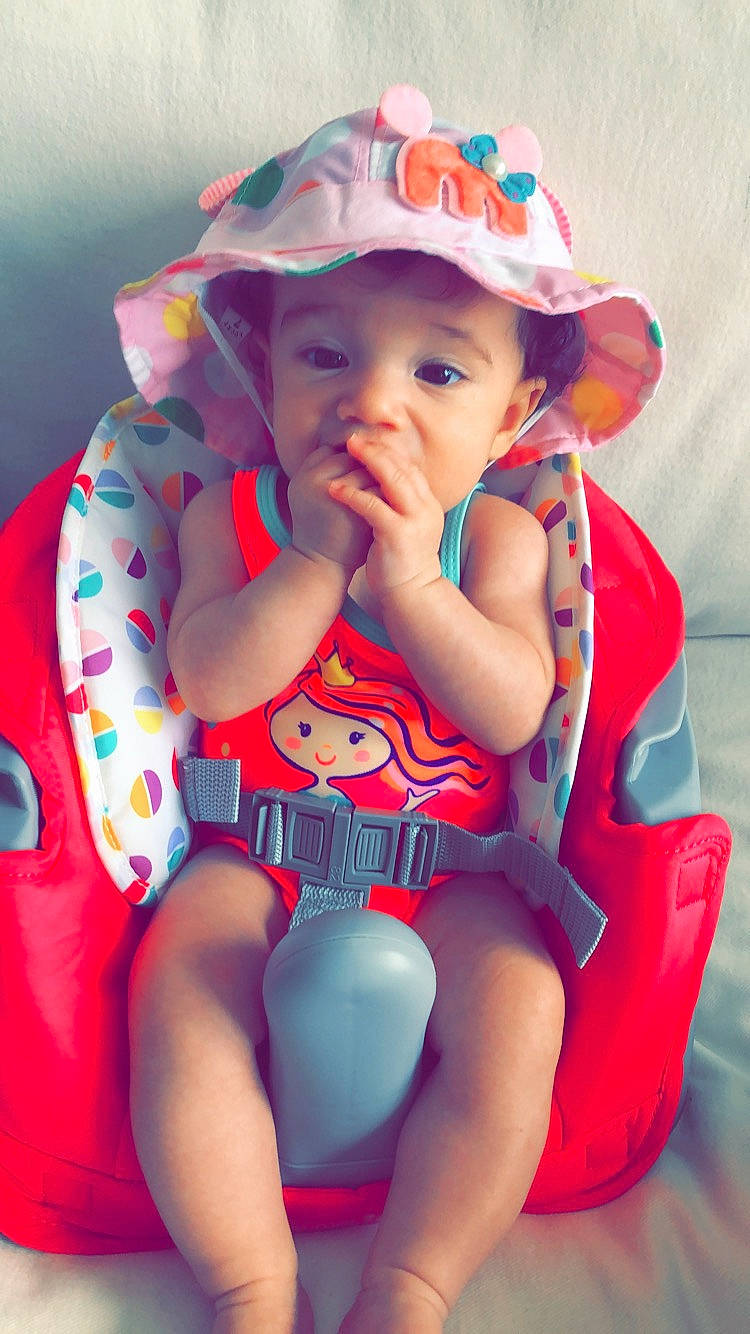 Annalynn is registered to the contest to win money with this photo: child, fashion_accessory, hat, headgear, person, pink, sitting, sun_hat, thigh, toddler