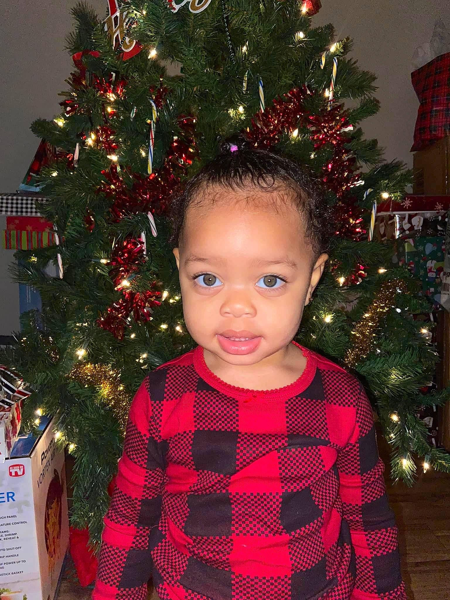 Milayah joined the competition — help win amazing prizes! baby_toddler_clothing, black, christmas, christmas_decoration, christmas_ornament, christmas_tree, conifer, event, evergreen, happy, holiday, holiday_ornament, ornament, person, plant, red, shortstraw_pine, sleeve, standing, toddler