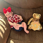 Aubrey joined the competition — help win amazing prizes! baby, infant, child, smiling, sitting, couch, teddy_bear, plush_toy, red_bow, checkered_outfit, dress, barefoot, portrait, indoor, sunlight, brown_sofa, five_months, happy, milestone, family_photo