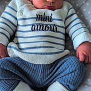 Amael participe au concours pour gagner de l'argent avec cette photo : baby, newborn, sleeping, knitwear, sweater, mini_amour, blue_pants, white_socks, polka_dot, cushion, infant, closeup, cute, peaceful, soft_lighting, indoors, portrait, hands, face, resting