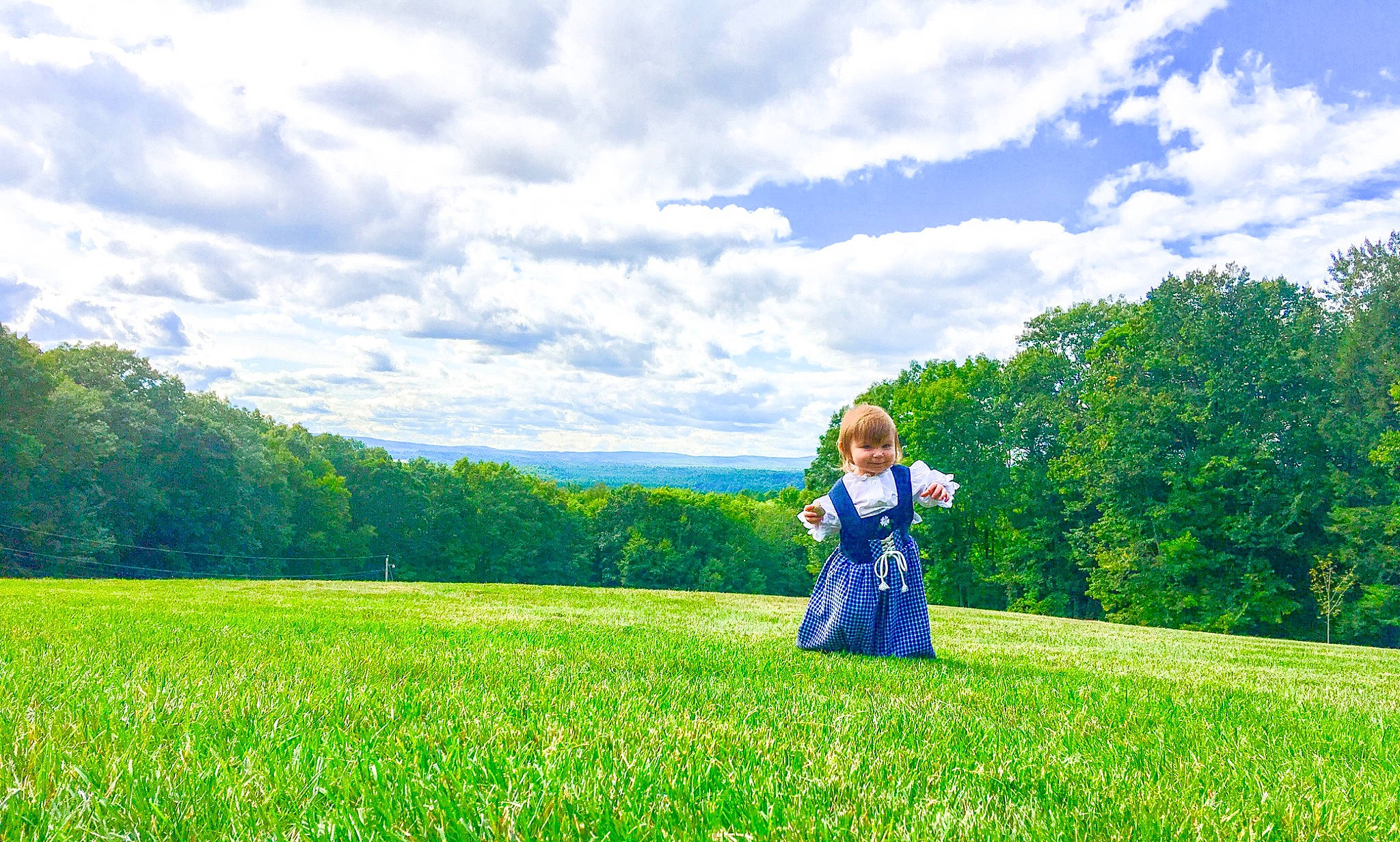 Kaylee is registered to the contest to win money with this photo: child, cloud, field, grass, grass_family, grassland, green, joy, lawn, meadow, natural_environment, natural_landscape, pasture, people_in_nature, person, photograph, photography, plant, sky, spring