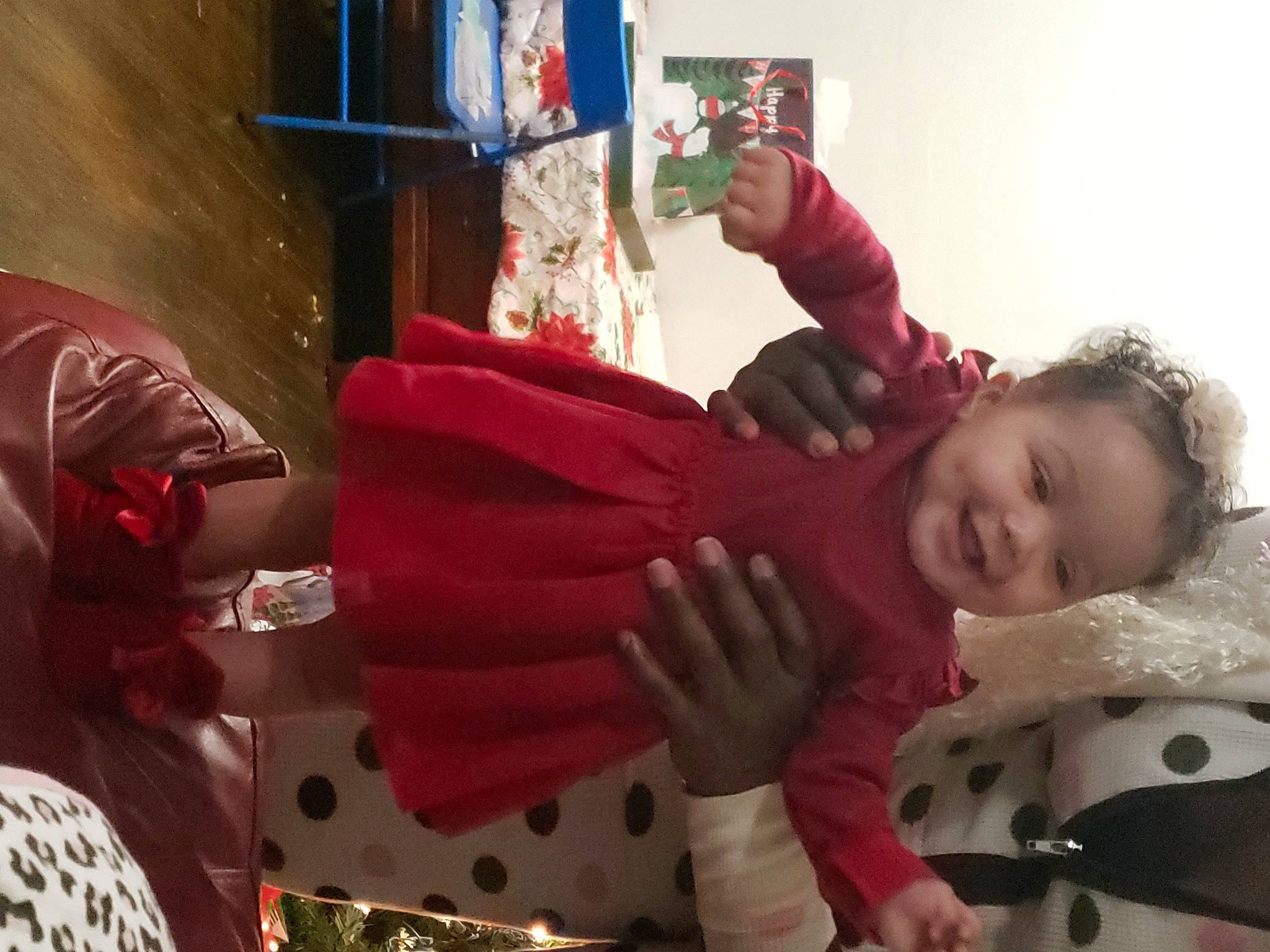 Zin'Nia is registered to the contest to win money with this photo: baby, carmine, child, christmas, christmas_eve, costume, event, fictional_character, fun, fur, happy, holiday, joy, magenta, person, plant, room, sitting, snapshot, toddler