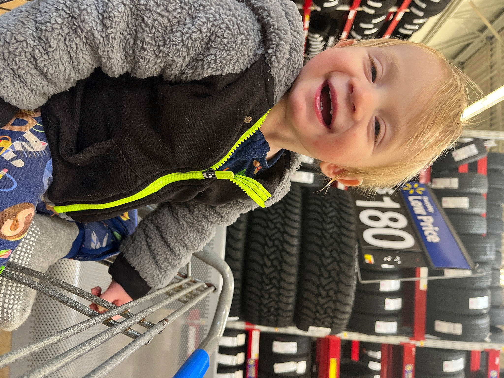 Archer is registered to the contest to win money with this photo: automotive_tire, child, elbow, electric_blue, engineering, fun, happy, joy, pattern, person, personal_protective_equipment, sleeve, smile, toddler