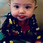 Ember is registered to the contest to win money with this photo: baby, bodypart, clothing, cosmetics, couch, crawling, face, finger, furniture, hand, happy, head, lipstick, mouth, pajamas, person, photography, portrait, sitting, smile