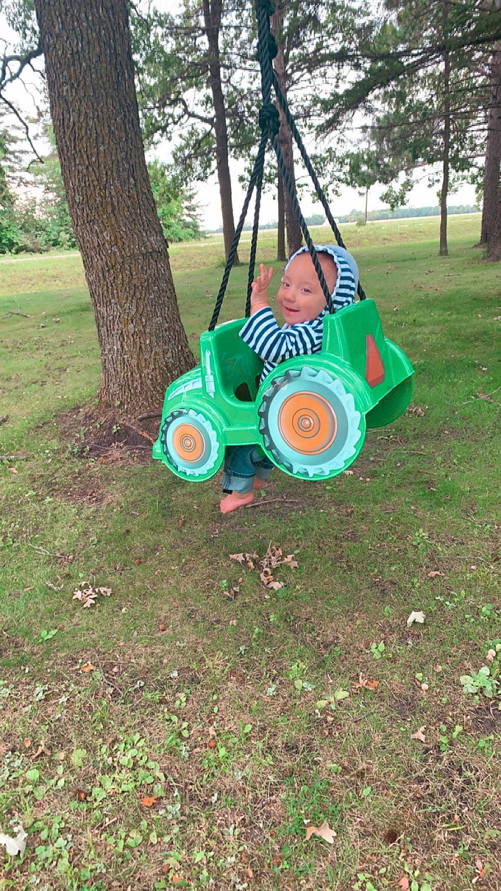 Jonah is registered to the contest to win money with this photo: auto_part, automotive_tire, automotive_wheel_system, event, grass, grassland, headwear, joy, motor_vehicle, musical_instrument, person, plant, recreation, rolling, soil, spoke, tire, tread, tree, vehicle