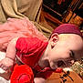 baby, child, tutu, pink, red_shirt, headband, laughing, toy, plush_toy, happy, candid, indoor, floor, necklace, person, cute, smile, infant, clothing, joyful