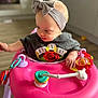 Isabella-Rayne is registered to the contest to win money with this photo: baby, bow, child, clothing, curious, expression, floor, flooring, furniture, guns_n_roses, hand, headband, indoor, person, pink, shirt, soft_focus, toy, walker, young_child