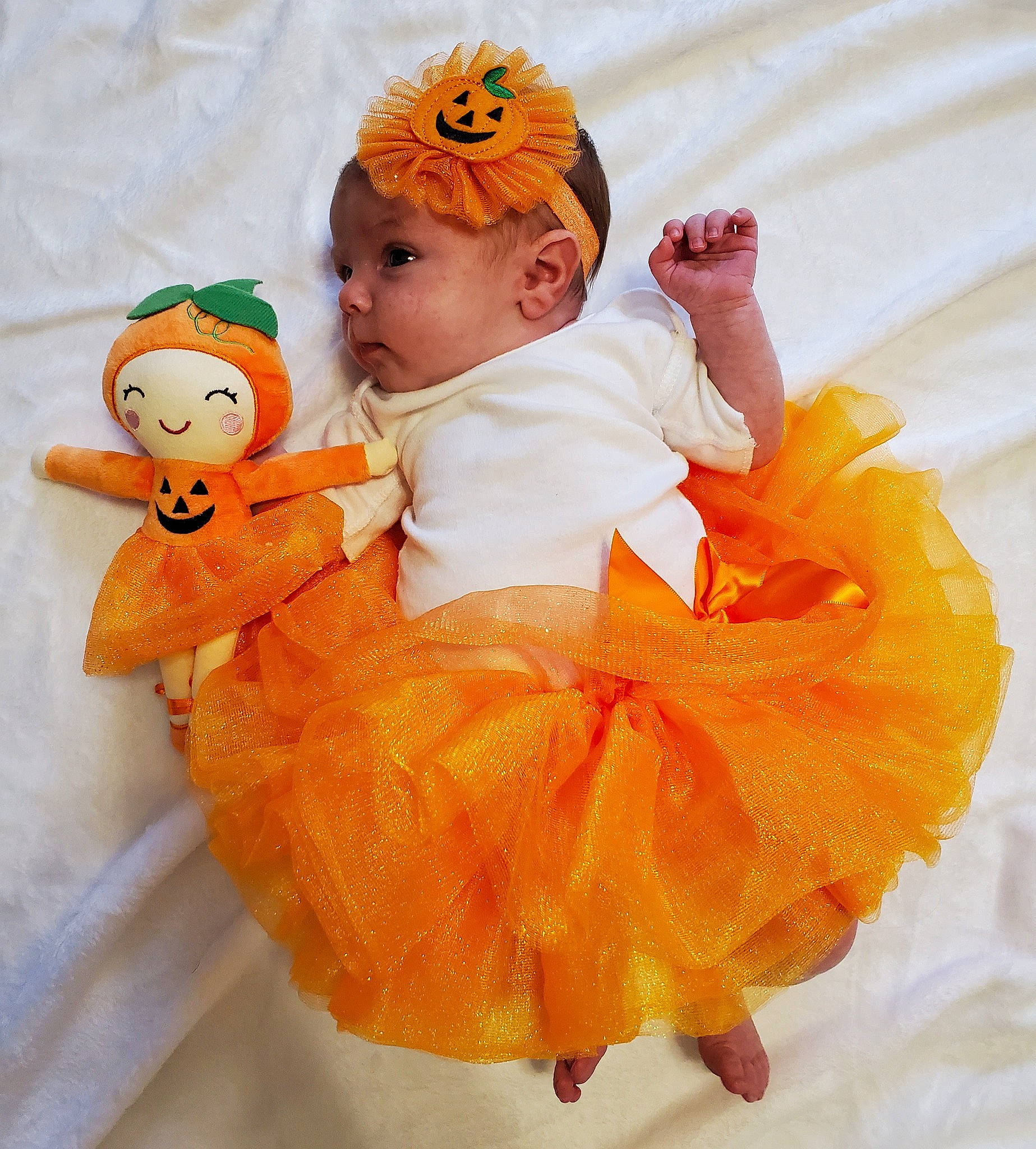 Macy is registered to the contest to win money with this photo: baby, baby_products, baby_sleeping, baby_toddler_clothing, baby_toys, child, comfort, costume, costume_hat, doll, fashion_accessory, happy, headgear, orange, peach, person, pumpkin, sitting, stuffed_toy, toddler