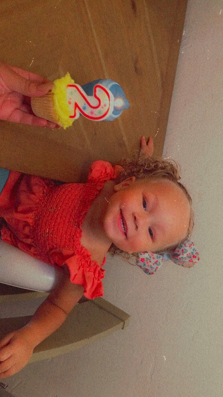 Alaia is registered to the contest to win money with this photo: baby, baby_toddler_clothing, cheek, child, flooring, fun, happy, human_leg, joy, magenta, pattern, peach, person, pink, room, skin, sleeve, smile, thigh, toddler