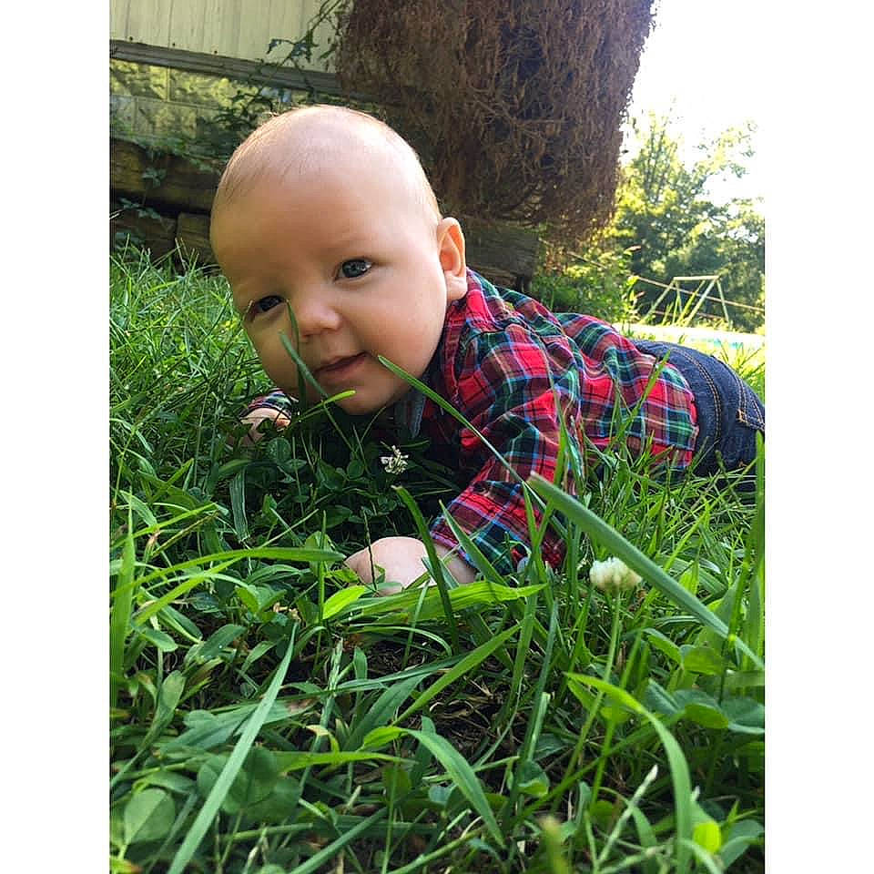 Jarred is registered to the contest to win money with this photo: baby, baby_laughing, baby_toddler_clothing, child, grass, grass_family, human, lawn, mouth, people_in_nature, person, toddler