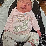 Arora joined the competition — help win amazing prizes! baby, bed, blanket, child, clothing, comfort, cozy, cute, face, feet, hat, indoor, infant, newborn, pajamas, person, relaxation, rest, sleeping, socks