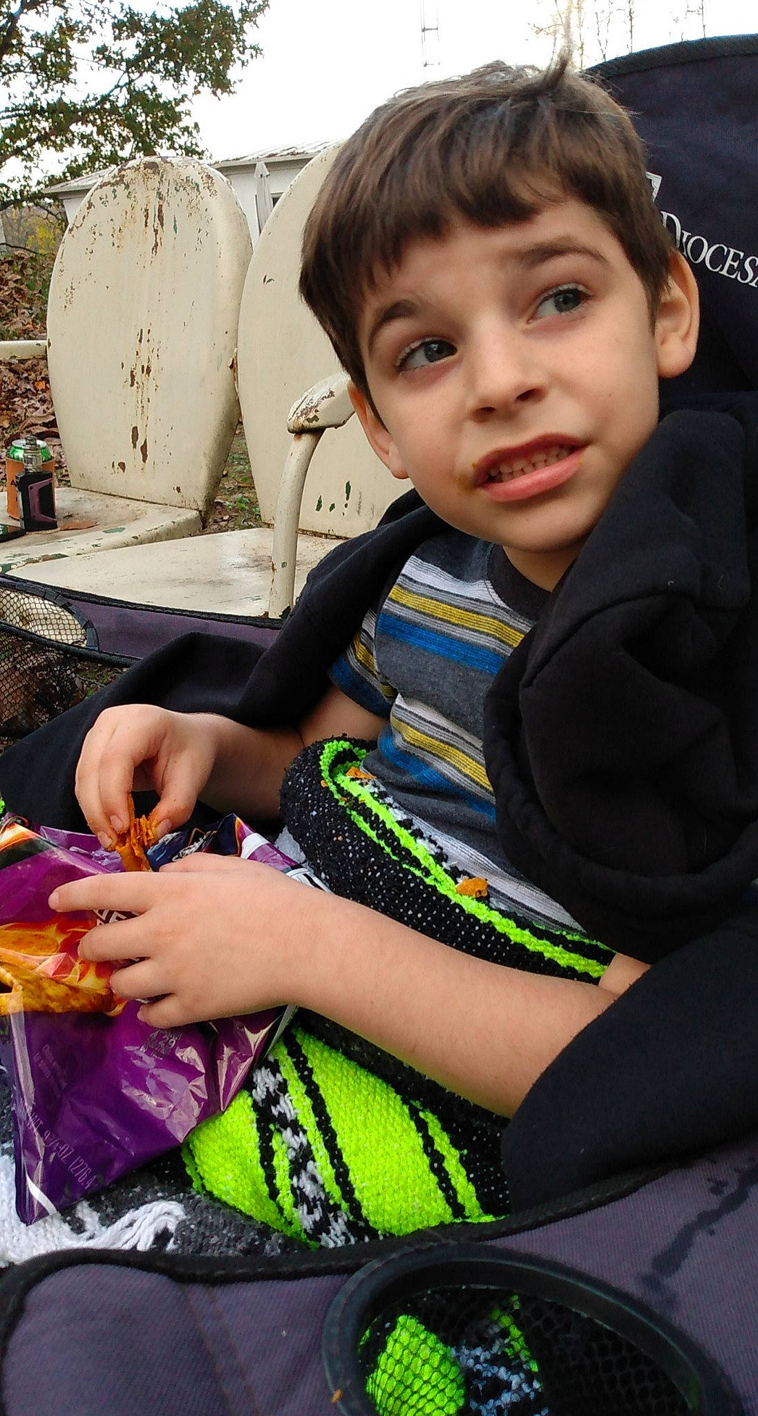 Cole is registered to the contest to win money with this photo: child, facial_expression, fashion, fashion_accessory, fashion_design, finger, fun, grass, hairstyle, hand, happy, jewellery, leisure, person, recreation, sitting, skin, sleeve, smile, t_shirt