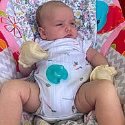 Delaney is registered to the contest to win money with this photo: baby, baby_boy, baby_girl, baby_seat, child, closeup, colorful, cute, floral_pattern, indoor, infant, mittens, newborn, onesie, pacifier, pink, portrait, resting, soft_toys, white_clothing