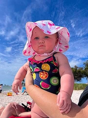 Bristol joined the competition — help win amazing prizes! baby, baby_toddler_clothing, blue, cap, cloud, fun, happy, headwear, human_leg, leisure, magenta, people_in_nature, person, pink, recreation, skin, sky, sleeve, sun_hat, thigh