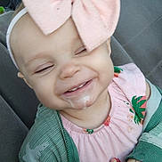 Jessame is registered to the contest to win money with this photo: accessories, baby, bodypart, clothing, coat, cushion, dress, face, formalwear, happy, head, homedecor, jacket, laughing, mouth, person, photography, portrait, smile, tie