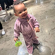 Mckenzie joined the competition — help win amazing prizes! toddler, child, smiling, indoor, store, shopping, toy, pink_clothing, floor, concrete, person, sneakers, clothing_rack, blurred_background, happy, walking, young_child, casual_wear, holding_object, retail