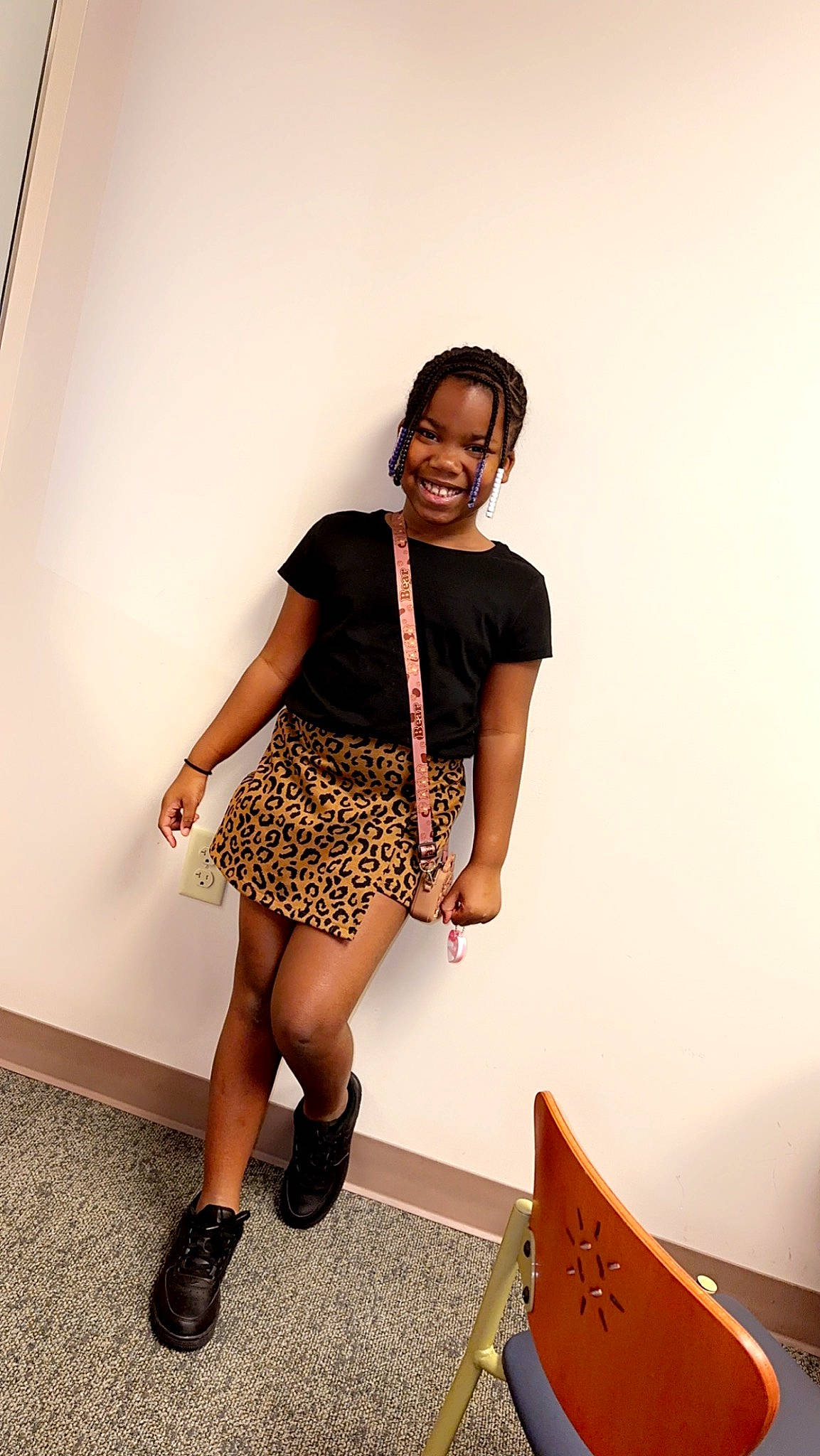 Gracie is registered to the contest to win money with this photo: bag, black_hair, day_dress, eyewear, fashion_design, flooring, hairstyle, human_leg, jewellery, joy, knee, leg, long_hair, neck, person, sandal, shoe, sleeve, smile, thigh