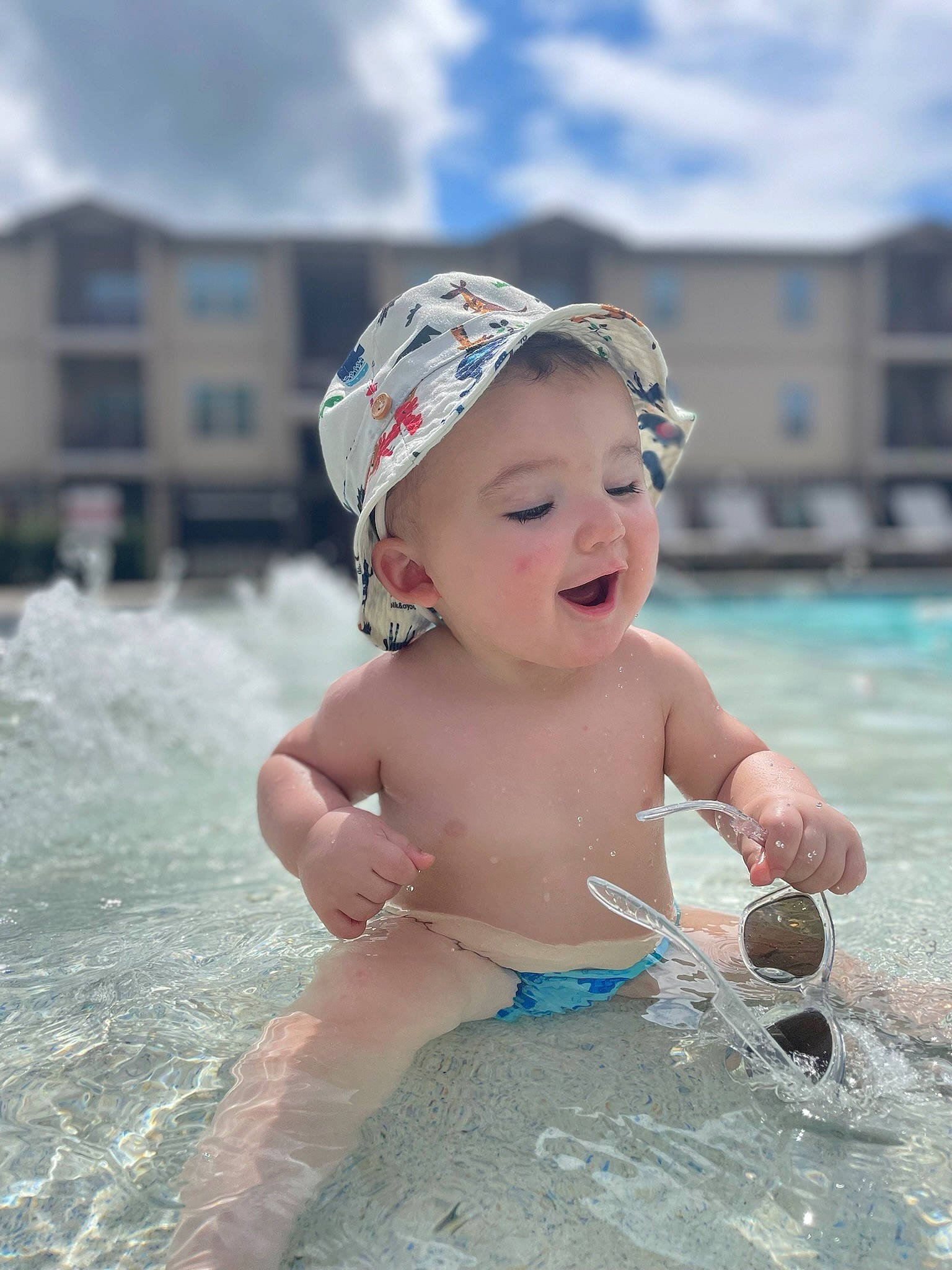 Kohen joined the competition — help win amazing prizes! baby, baby_toddler_clothing, bathing, cap, child, cloud, fashion_accessory, fun, happy, hat, headwear, leisure, person, personal_protective_equipment, recreation, sand, sky, smile, swimming_pool, toddler