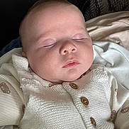 Atreus joined the competition — help win amazing prizes! baby, sleeping, face, infant, white_clothing, knitwear, buttons, peaceful, closeup, portrait, resting, soft, indoors, child, young, cute, skin, head, eyes_closed, newborn