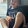 Arlo joined the competition — help win amazing prizes! child, boy, smiling, sitting, indoor, couch, socks, shirt, window, light, happy, casual, home, portrait, legs, face, furniture, relaxed, young, cute