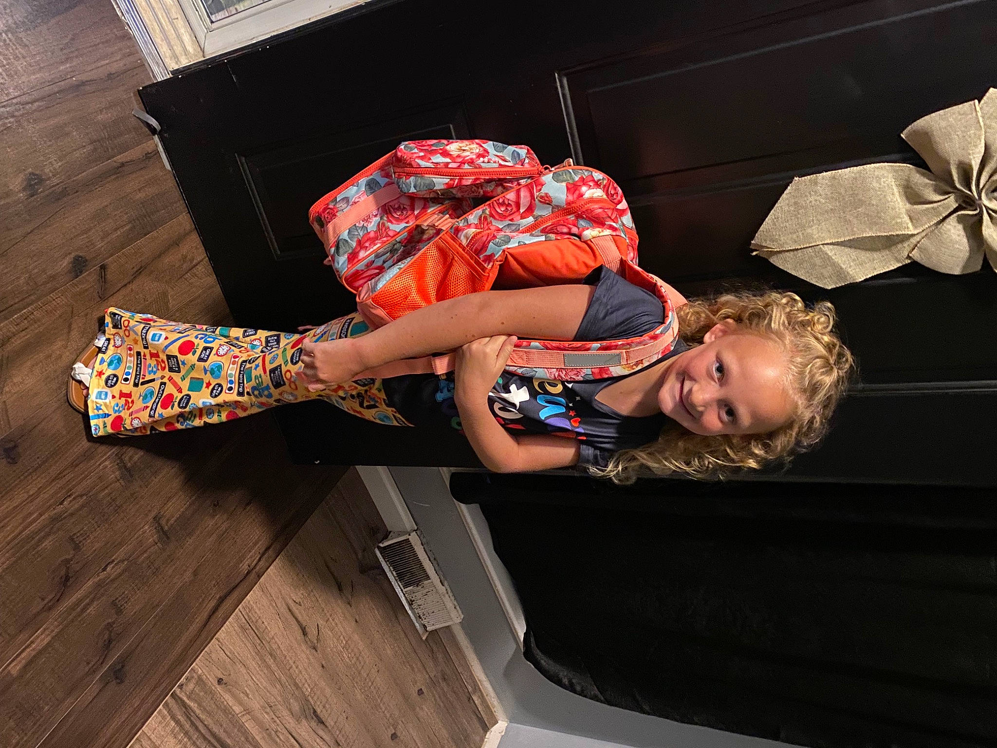 Laila is registered to the contest to win money with this photo: dress, elbow, fashion_accessory, fashion_design, flesh, flooring, fun, hardwood, human_leg, joy, knee, pattern, person, sitting, smile, thigh, umbrella, waist, wood, wood_stain