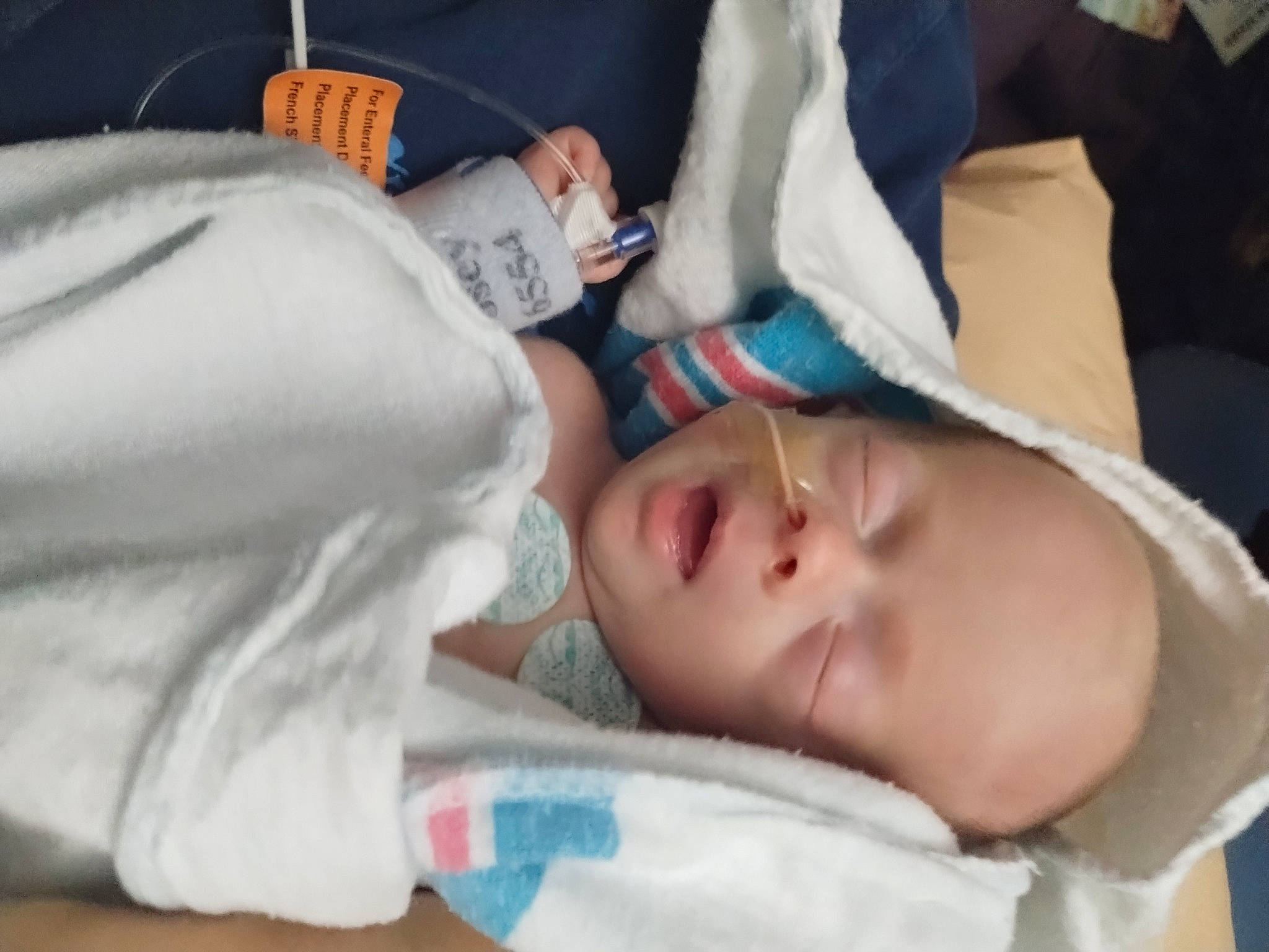 Bentley is registered to the contest to win money with this photo: baby, baby_products, baby_sleeping, baby_toddler_clothing, bedtime, cheek, child, comfort, elbow, eyelash, linens, mouth, nap, nose, person, room, sleep, toddler