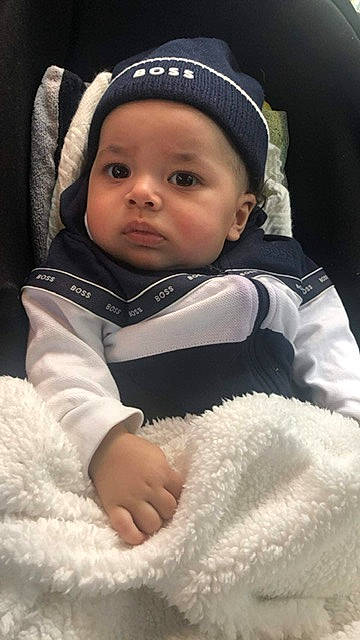 Naïl participe au concours pour gagner de l'argent avec cette photo : baby, baby_products, baby_toddler_clothing, beanie, cap, cheek, child, comfort, eye, eyebrow, flash_photography, fun, fur, grass, happy, head, headwear, person, sitting, sleeve