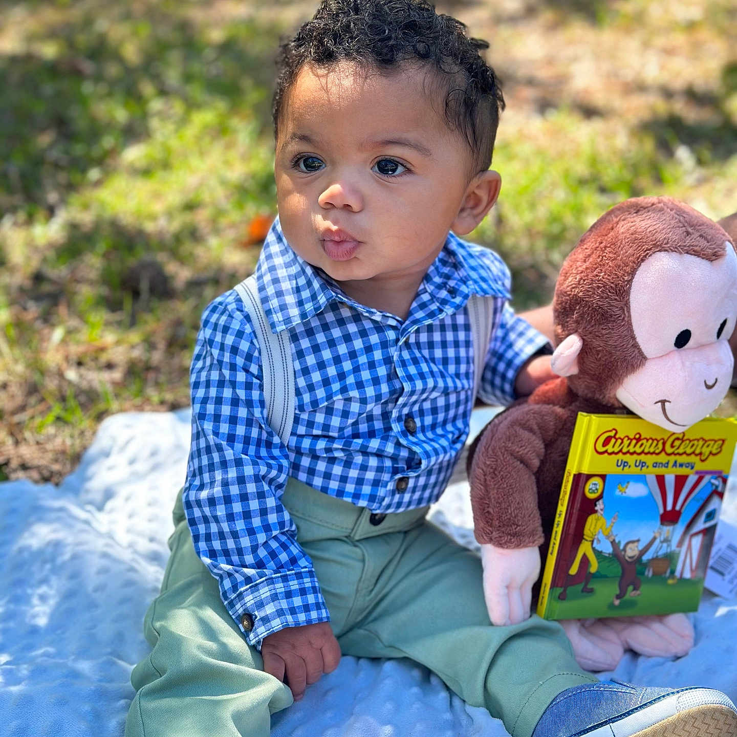 Collier is registered to the contest to win money with this photo: book, boy, child, clothing, face, footwear, grass, head, male, pants, person, photography, plant, portrait, publication, reading, shirt, shoe, sitting, toy