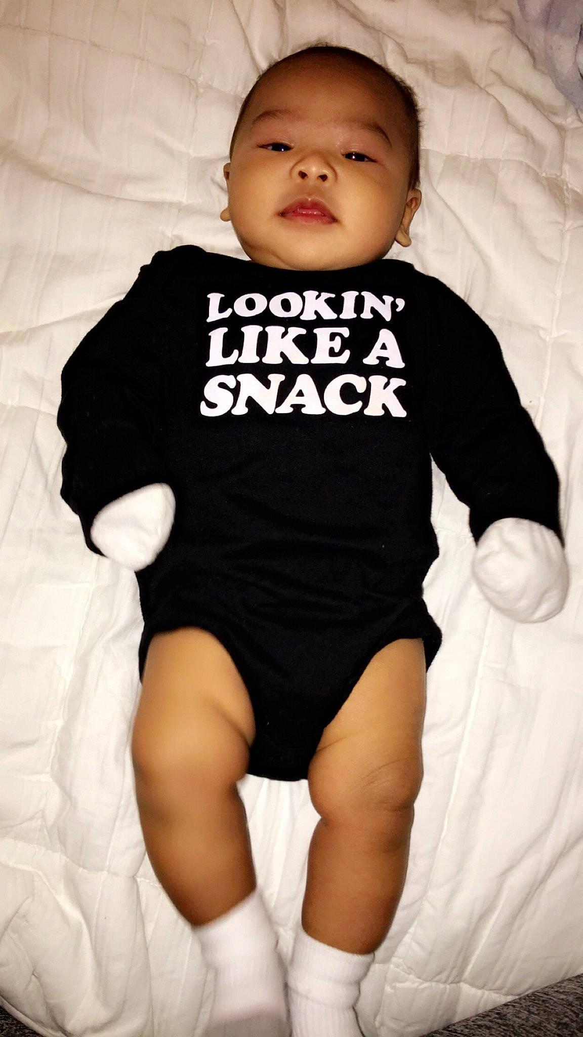 Kenji is registered to the contest to win money with this photo: abdomen, baby_products, black, child, cool, girl, infant, joint, leg, person, product, shoulder, sitting, skin, sleeve, smile, standing, t_shirt, toddler, top