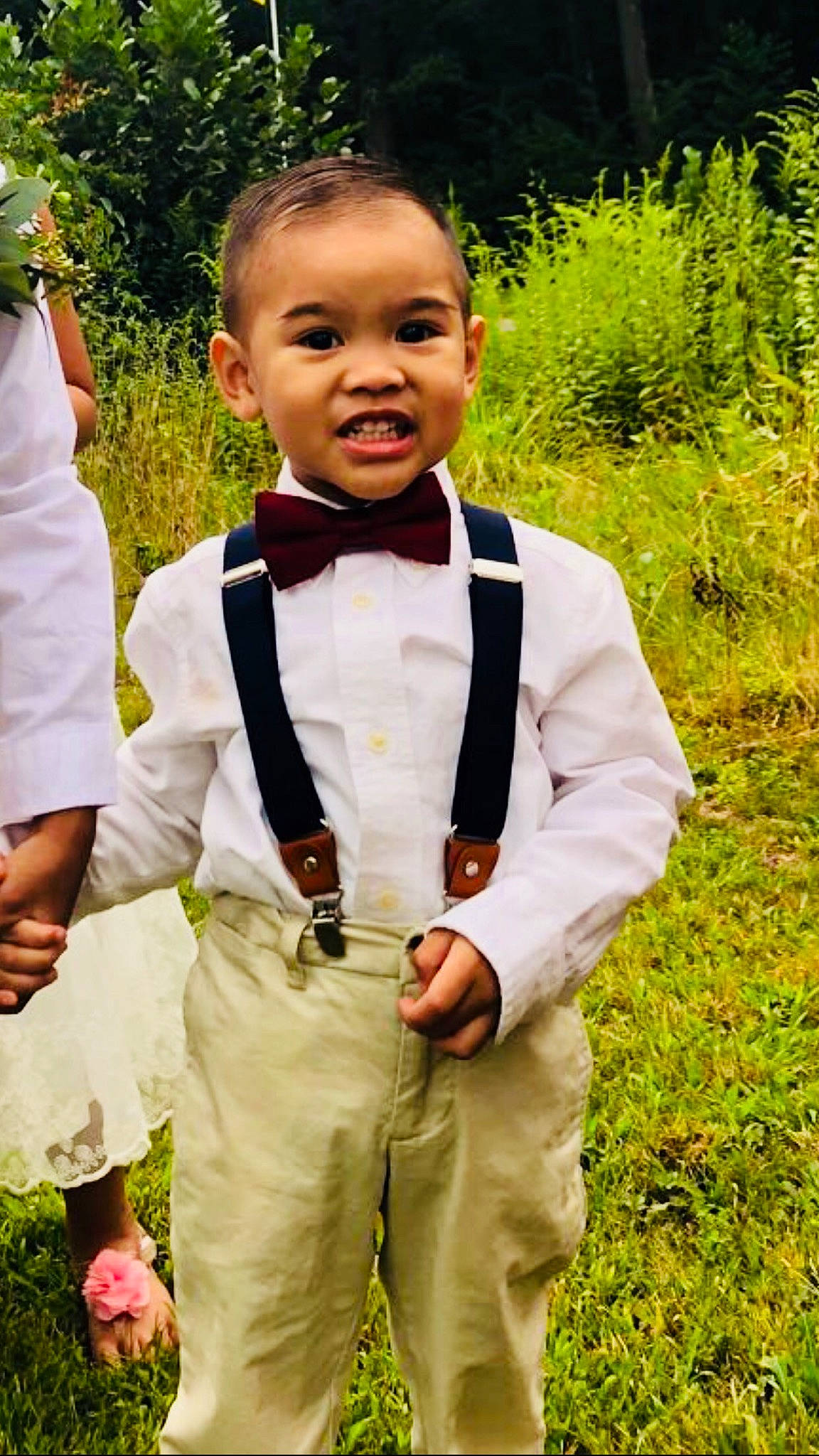 Kyedan is registered to the contest to win money with this photo: boy, ceremony, child, formal_wear, fun, girl, grass, groom, happiness, male, person, smile, suit, toddler, tuxedo