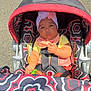 baby, child, stroller, seatbelt, headwrap, toy, outdoor, sunlight, pavement, colorful, patterned, clothing, infant, cute, portrait, seat, sitting, serious, young_child, person