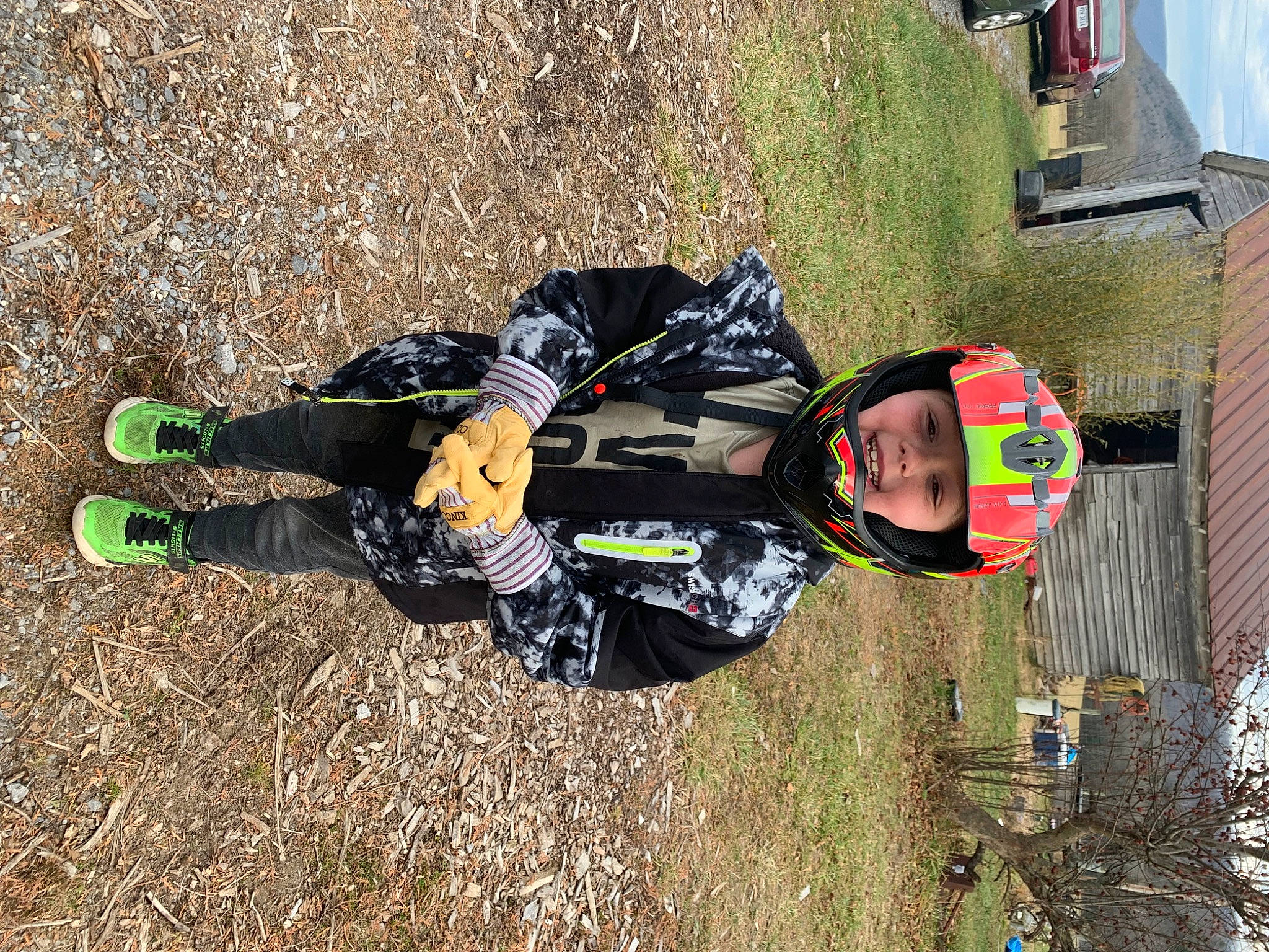 Bradlee is registered to the contest to win money with this photo: adventure, bicycle_helmet, bicycles_equipment_and_supplies, fun, glove, grass, headwear, helmet, mountain_bike, person, personal_protective_equipment, plant, racing, recreation, soil, sports, sports_equipment, sports_gear, toddler, tree