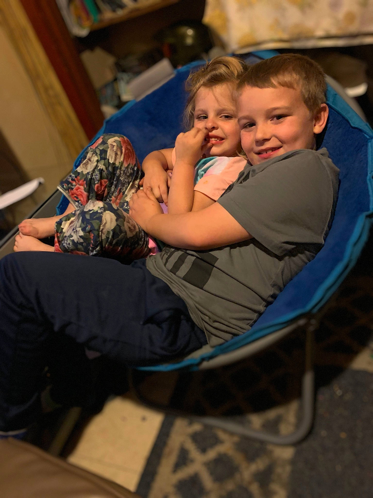 Bradlee joined the competition — help win amazing prizes! baby, bookcase, chair, child, comfort, event, fun, happy, human_leg, joy, lap, leisure, person, play, room, shelf, sitting, smile, t_shirt, thigh