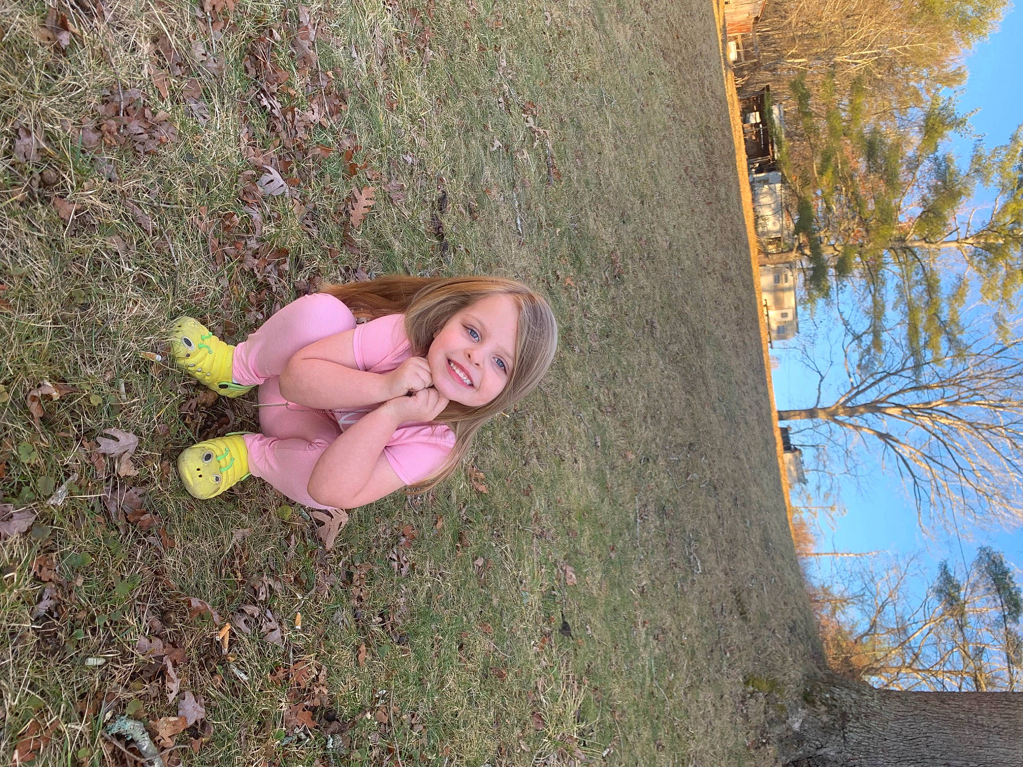 Teagan joined the competition — help win amazing prizes! branch, fawn, fun, grass, grass_family, hairstyle, happy, joy, leisure, people_in_nature, person, plant, sitting, sky, smile, soil, spring, thigh, toy, tree