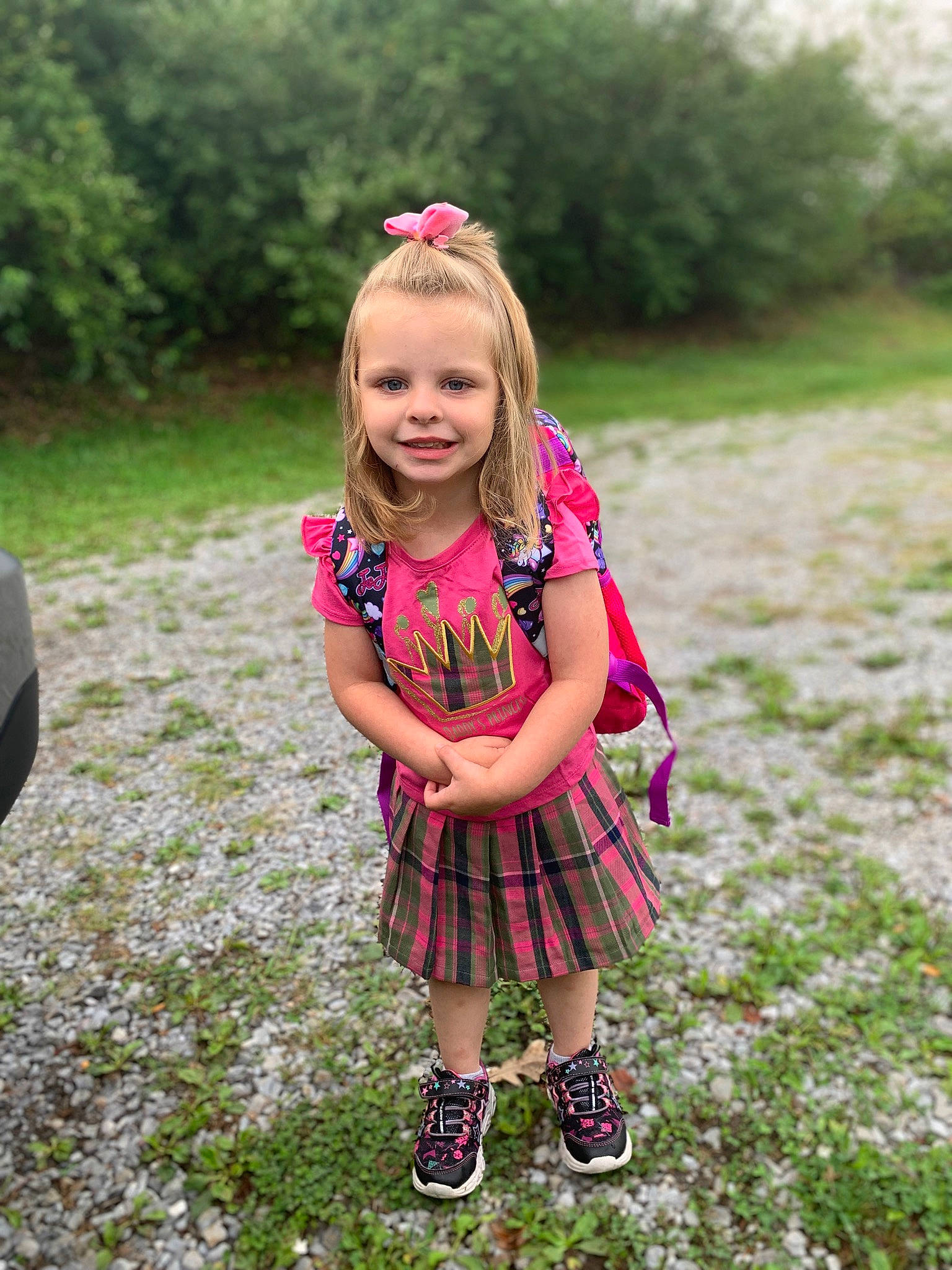 Teagan is registered to the contest to win money with this photo: baby_toddler_clothing, dress, face, flower, fun, grass, grass_family, grassland, happy, joy, leaf, magenta, meadow, people_in_nature, person, pink, plaid, plant, smile, summer