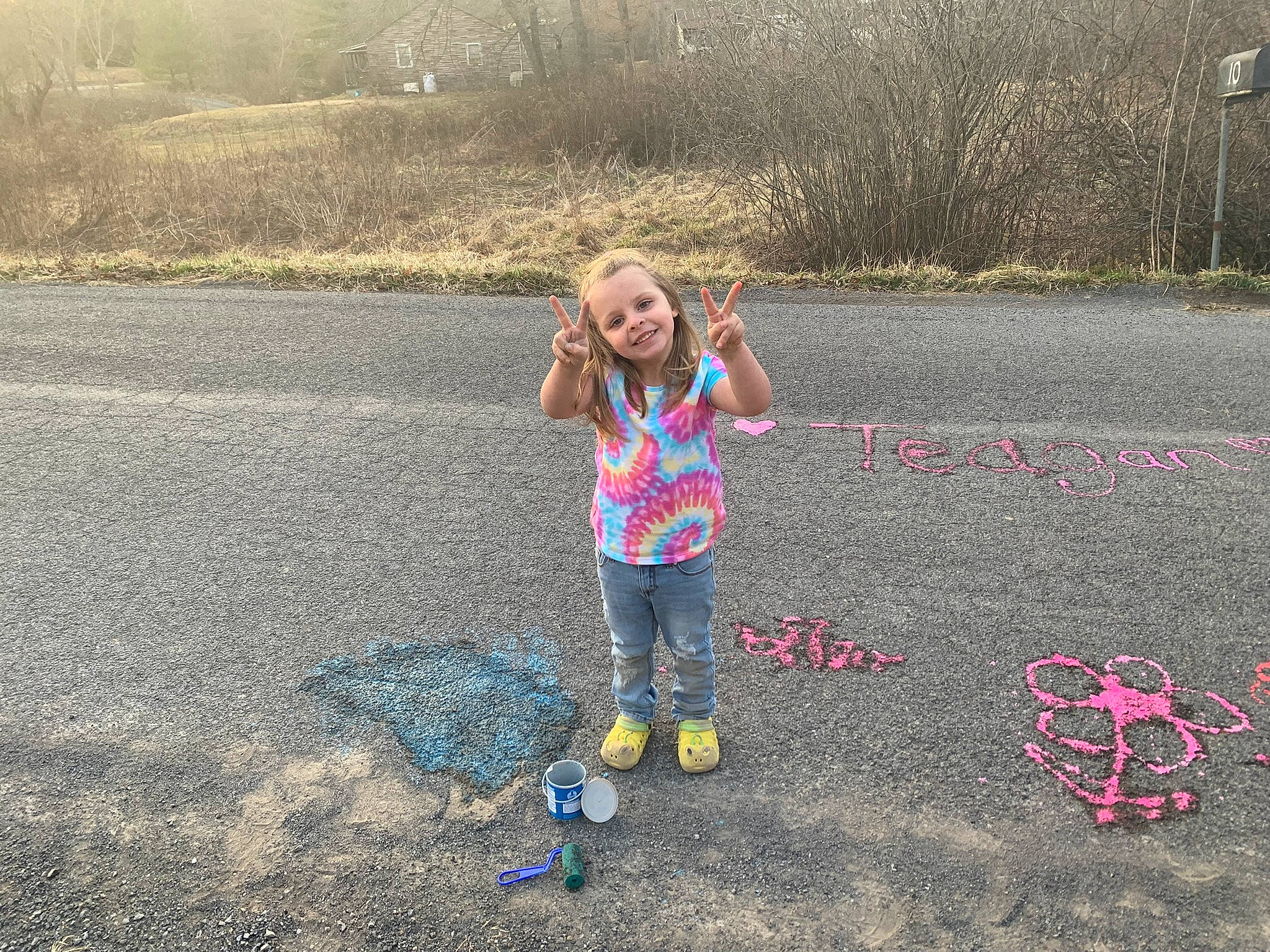 Teagan is registered to the contest to win money with this photo: asphalt, automotive_tire, child, ecoregion, fun, grass, grassland, happy, joy, landscape, leaf, leisure, natural_environment, nature, people_in_nature, person, plant, recreation, road_surface, sand