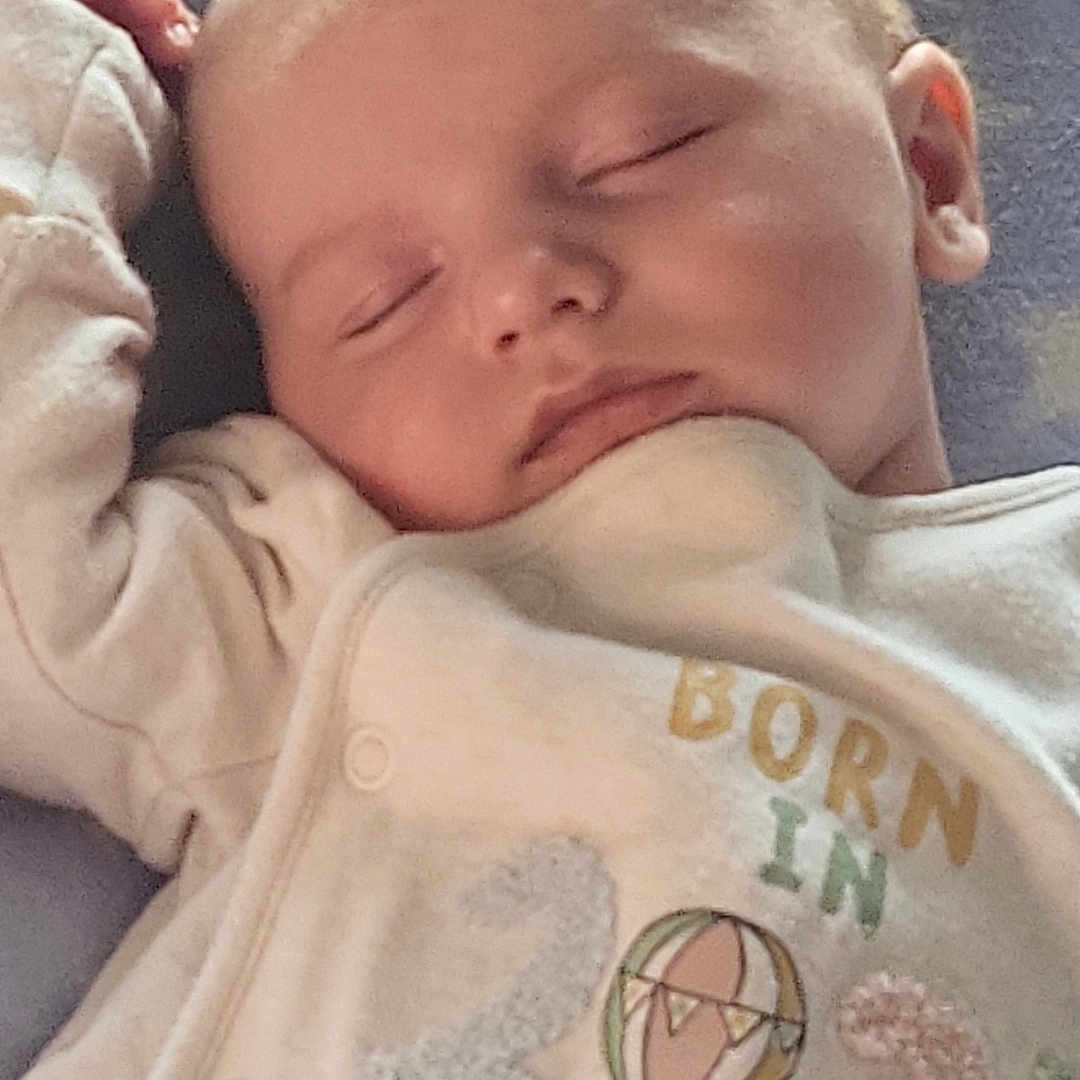 Keelan joined the competition — help win amazing prizes! adorable, baby, blanket, child, closeup, clothing, cozy, cute, face, head, indoor, infant, newborn, onesie, peaceful, portrait, resting, sleeping, soft_lighting, star_pattern