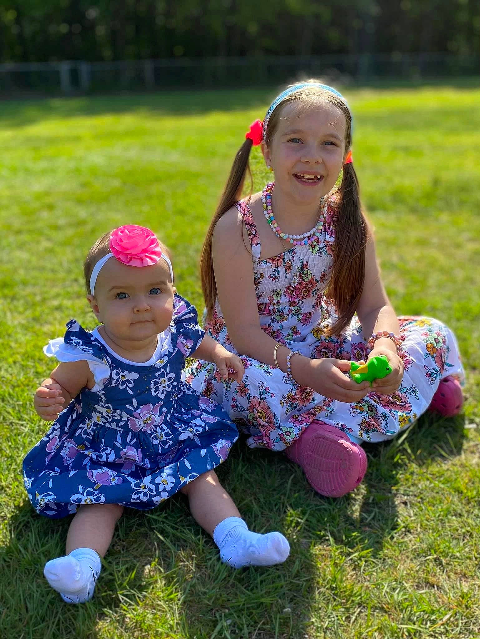 Ariana Elizabeth-rose joined the competition — help win amazing prizes! baby_toddler_clothing, child, event, eye, face, fun, grass, grass_family, grassland, happy, headwear, joy, leisure, meadow, people_in_nature, person, pink, plant, recreation, sitting