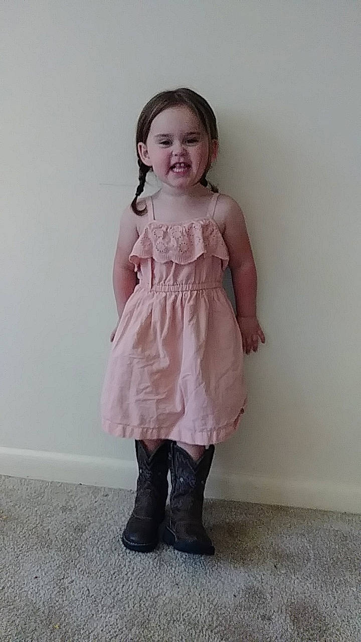 Gracie joined the competition — help win amazing prizes! beige, child, child_model, clothing, dress, fashion_design, footwear, formal_wear, knee, outerwear, pattern, person, pink, ruffle, sleeve, smile, standing, toddler