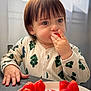 toddler, child, strawberry, fruit, plate, table, indoors, window, curtain, onesie, patterned_clothing, eating, hand, face, brown_hair, cute, natural_light, portrait, food, young_child