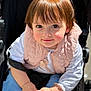Amélie participe au concours pour gagner de l'argent avec cette photo : child, toddler, baby, face, eyes, hair, clothing, vest, jacket, hand, stroller, seat, person, portrait, outdoor, sunlight, cute, smile, skin, babywearing