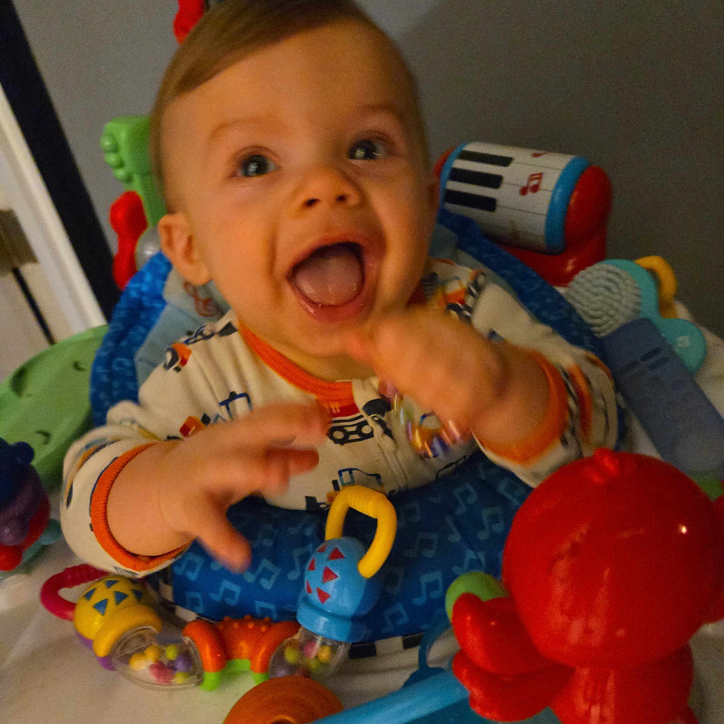 Roman is registered to the contest to win money with this photo: baby, balloon, bodypart, chair, crib, cutlery, face, finger, furniture, hand, head, infantbed, inflatable, person, photography, portrait, rattle, sitting, spoon, toy