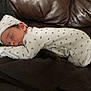 newborn, baby, sleeping, onesie, hat, infant, cozy, cute, resting, soft, peaceful, child, face, clothing, indoor, leather, fabric, pattern, portrait, relaxation