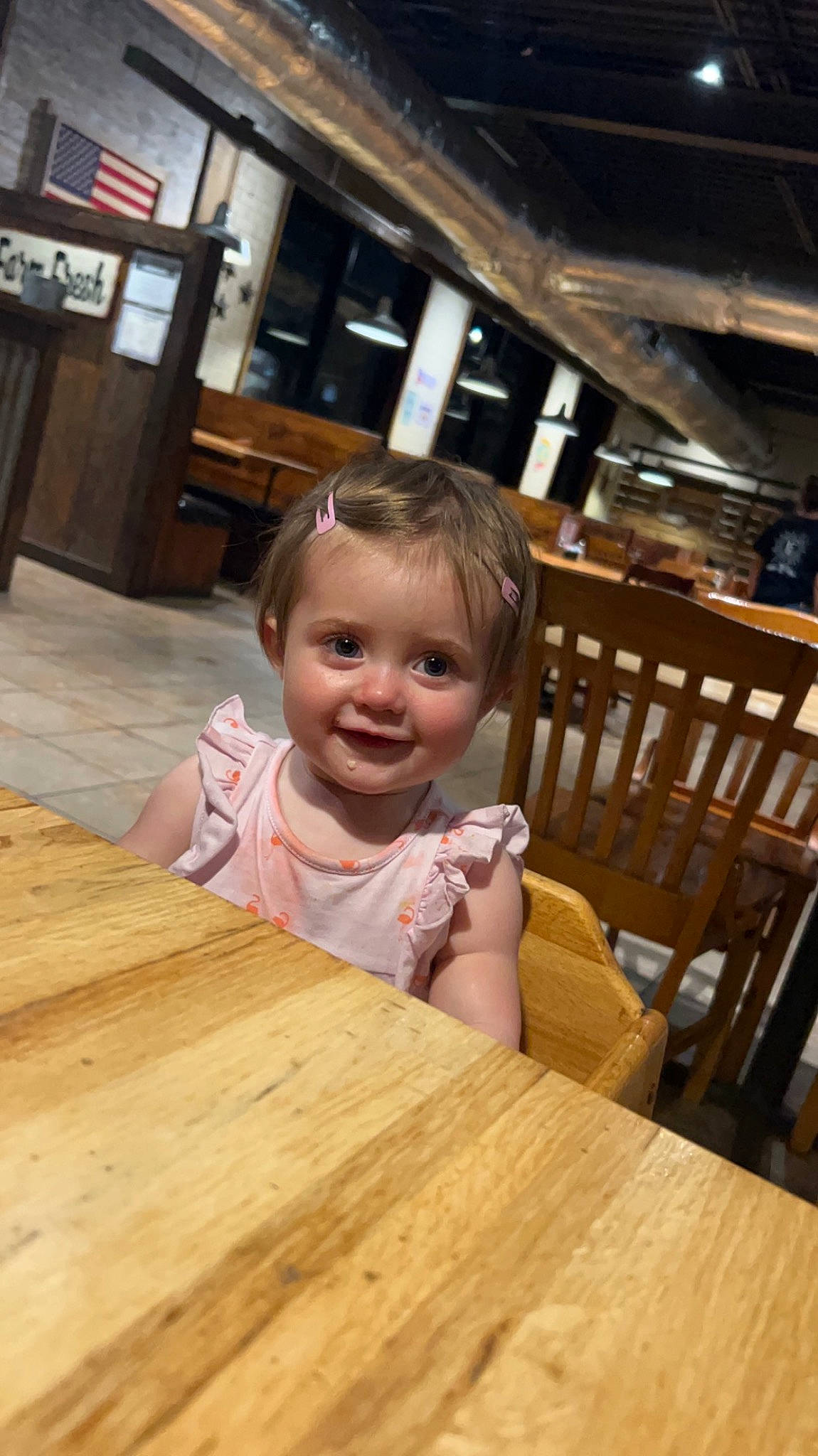 Avrianna joined the competition — help win amazing prizes! chair, desk, floor, flooring, furniture, happy, hardwood, joy, kitchen_dining_room_table, laminate_flooring, person, plank, plywood, sitting, smile, table, tableware, toddler, varnish, wood
