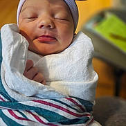 Jazlin joined the competition — help win amazing prizes! newborn, baby, sleeping, blanket, hat, bunny_ears, wrapped, cozy, soft_light, closeup, infant, peaceful, cute, indoors, person, child, face, mouth, nose, hand