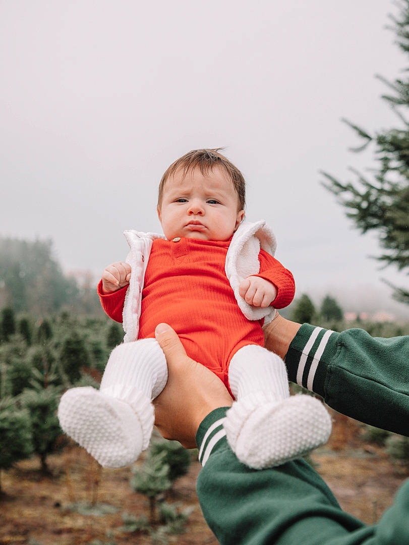Penelope is registered to the contest to win money with this photo: arm, baby, baby_toddler_clothing, child, face, finger, flash_photography, fun, gesture, grass, hand, happy, leisure, people_in_nature, person, plant, sitting, skin, sky, sorrow